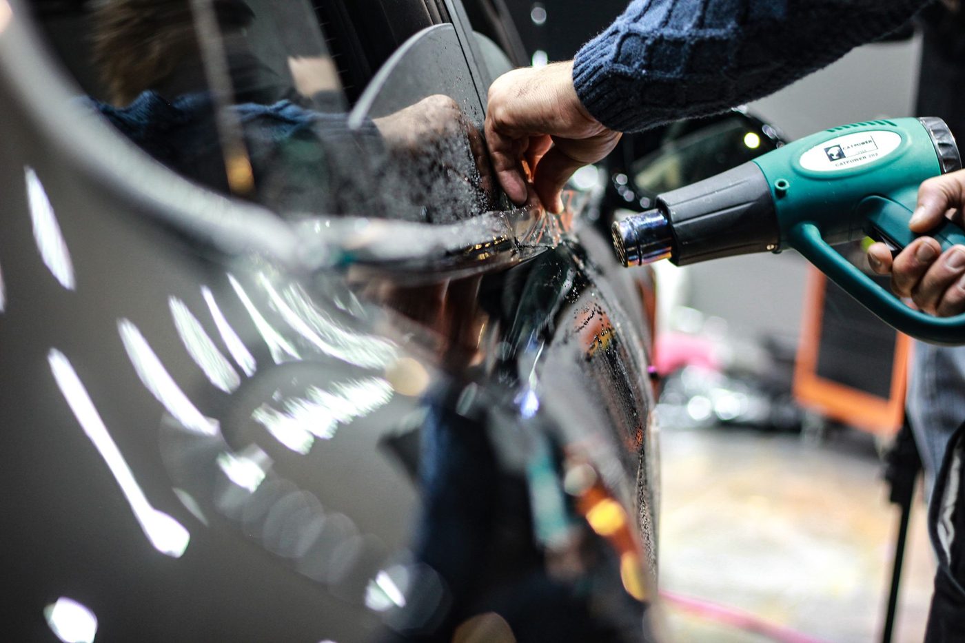 Window film being applied to door glass